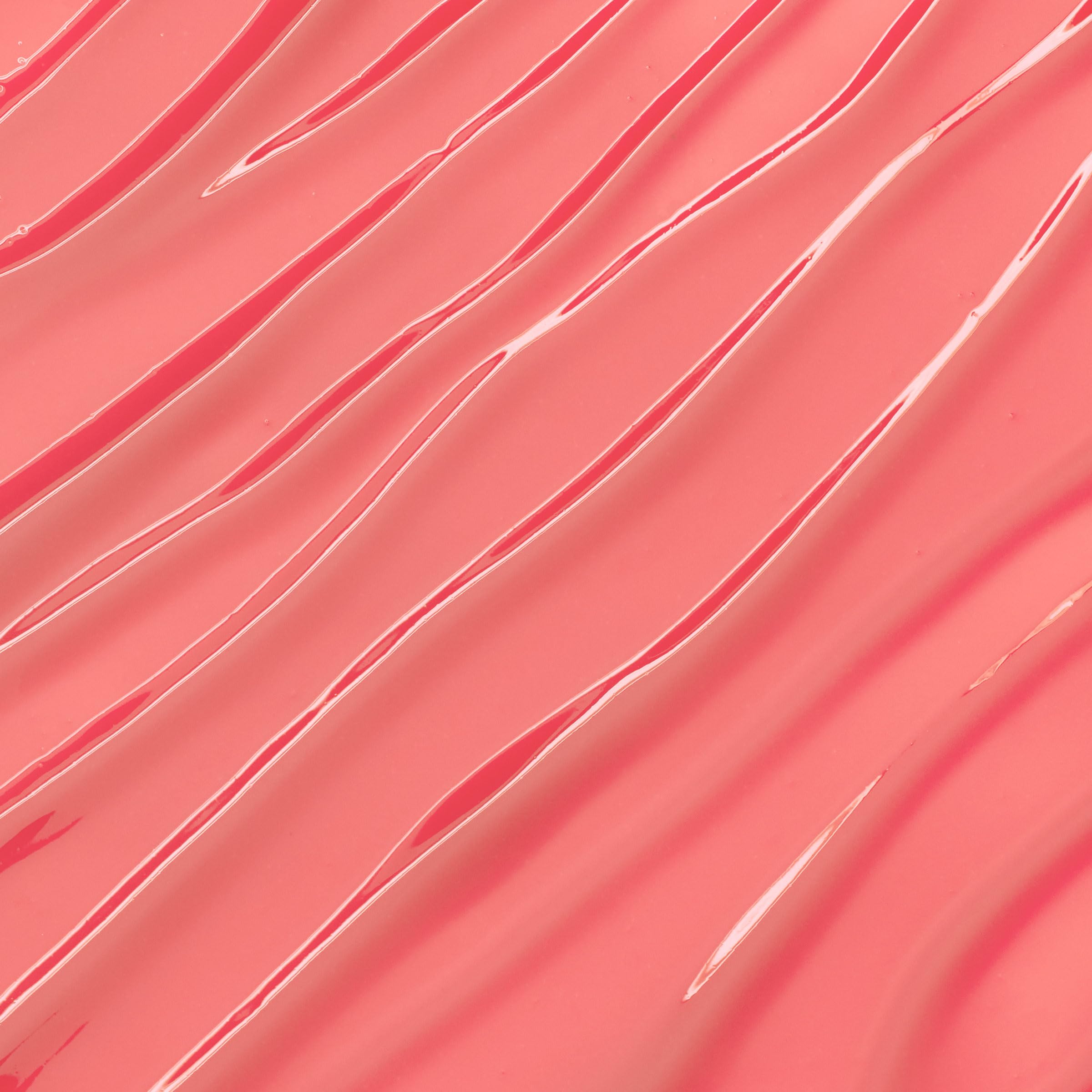 ColourPop Lux Lip Oil swatch-pink delivers a glossy finish with a lightweight feel.