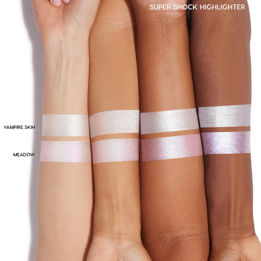 Fingertip application of ColourPop Twilight Highlighter for intense color