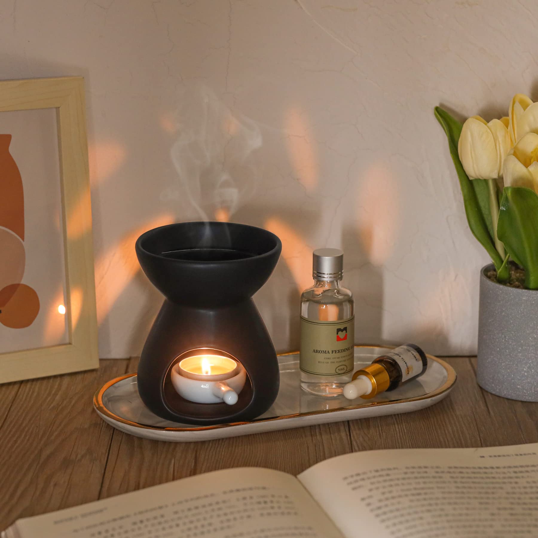 Two black ceramic oil burners with glossy glaze