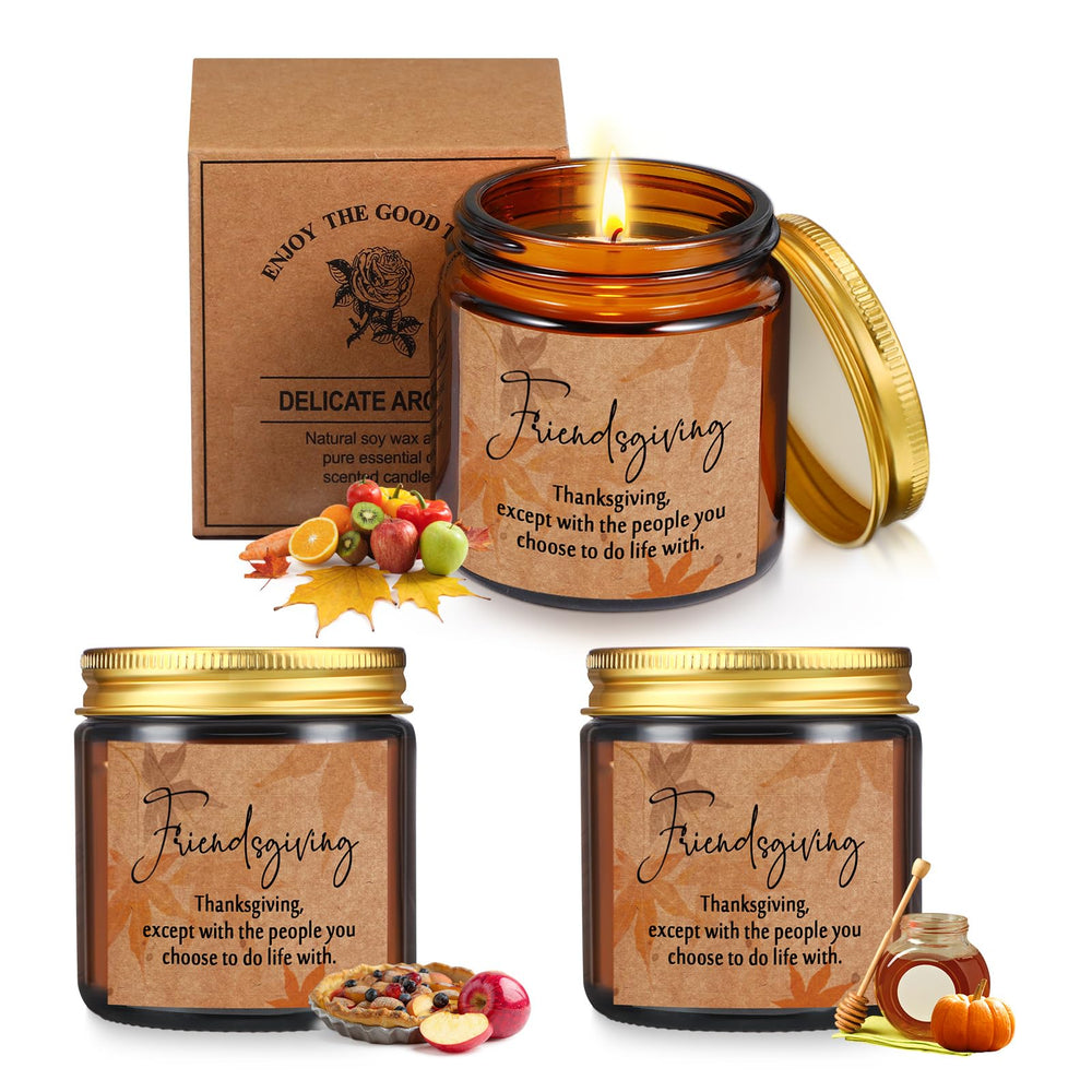 Three 3.5 oz soy wax candles in amber glass jars