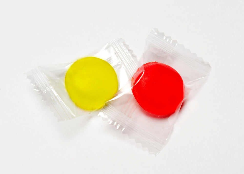 On-the-go resealable package with individually wrapped candies