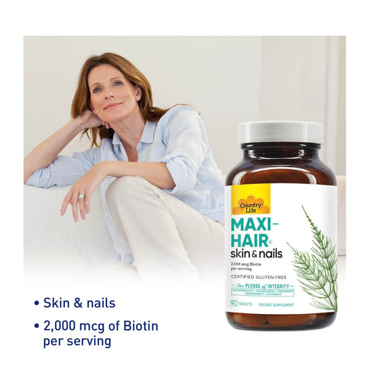 Close-up of Maxi-Hair ingredients including biotin and vitamins