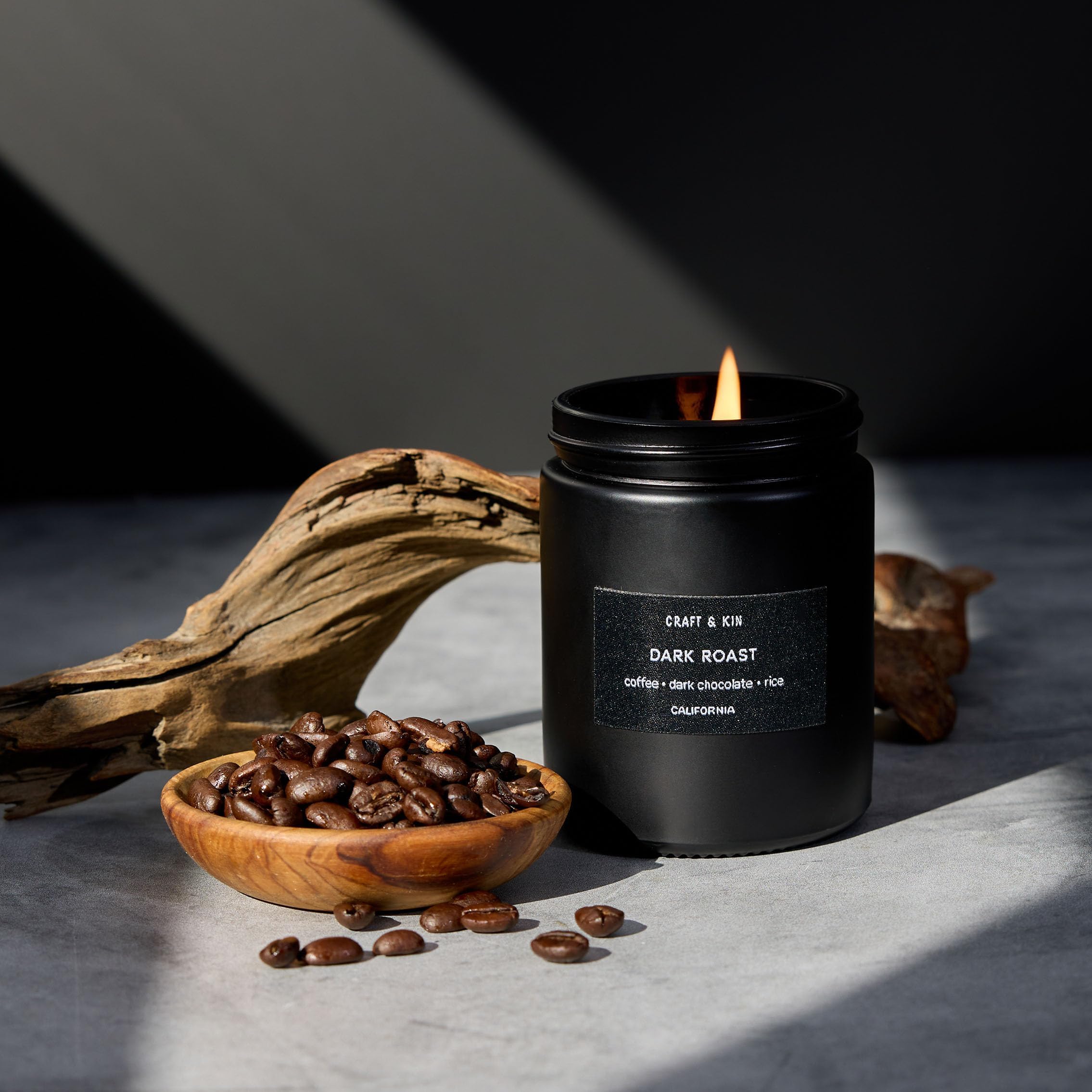 Soy wax candle in clear jar with dark roast coffee label