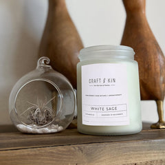 8 oz long-lasting holiday candle on wooden surface