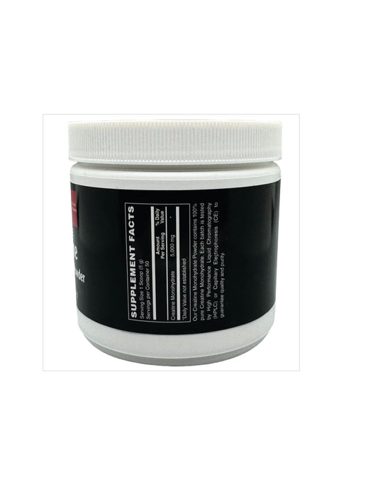 Scooped creatine monohydrate powder being poured