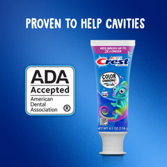 Smiling child brushing with Crest Chameleon toothpaste