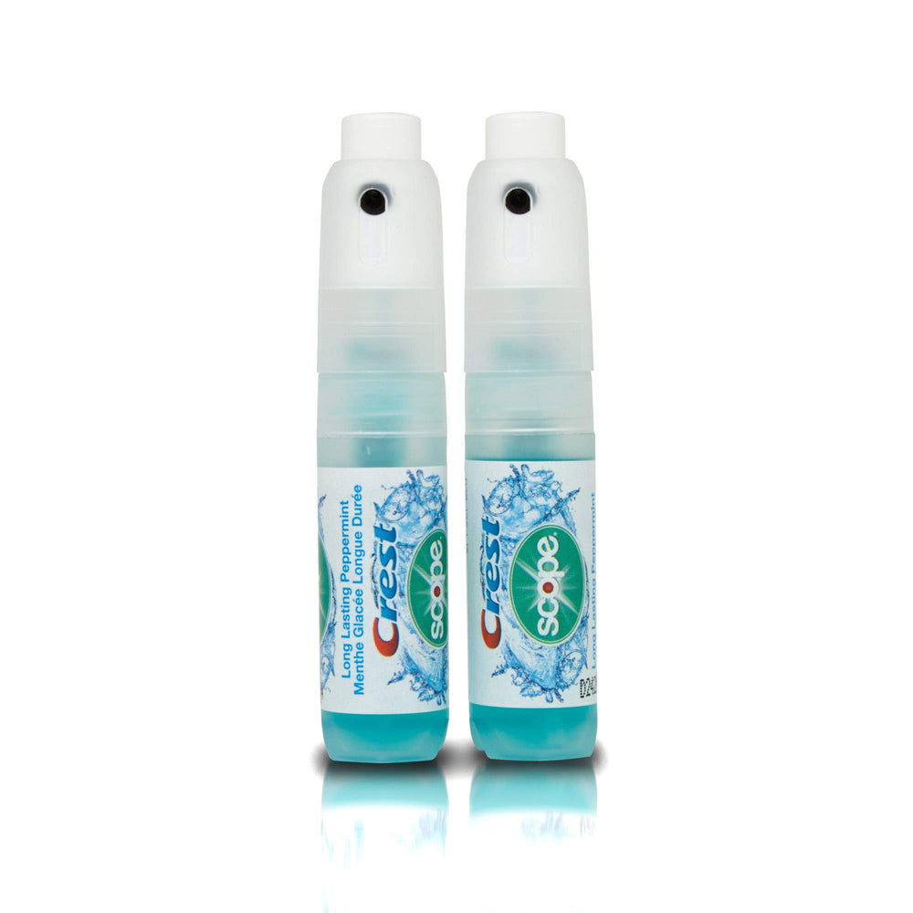 Close-up of Crest Breath Mist peppermint spray bottles for on-the-go use
