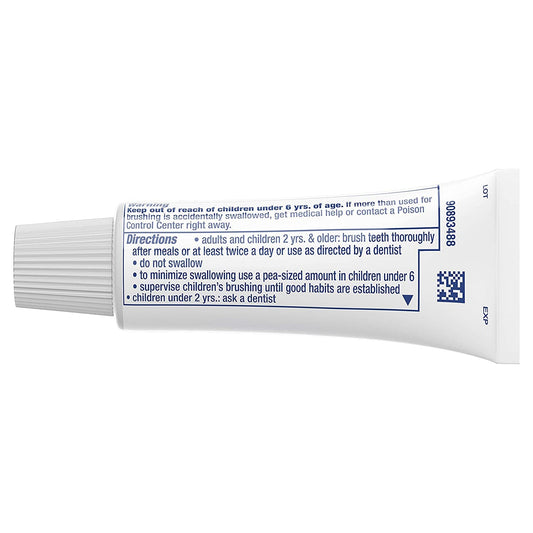 Close-up of Crest and Scope logos on toothpaste tube