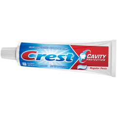 Crest toothpaste tube held in hand