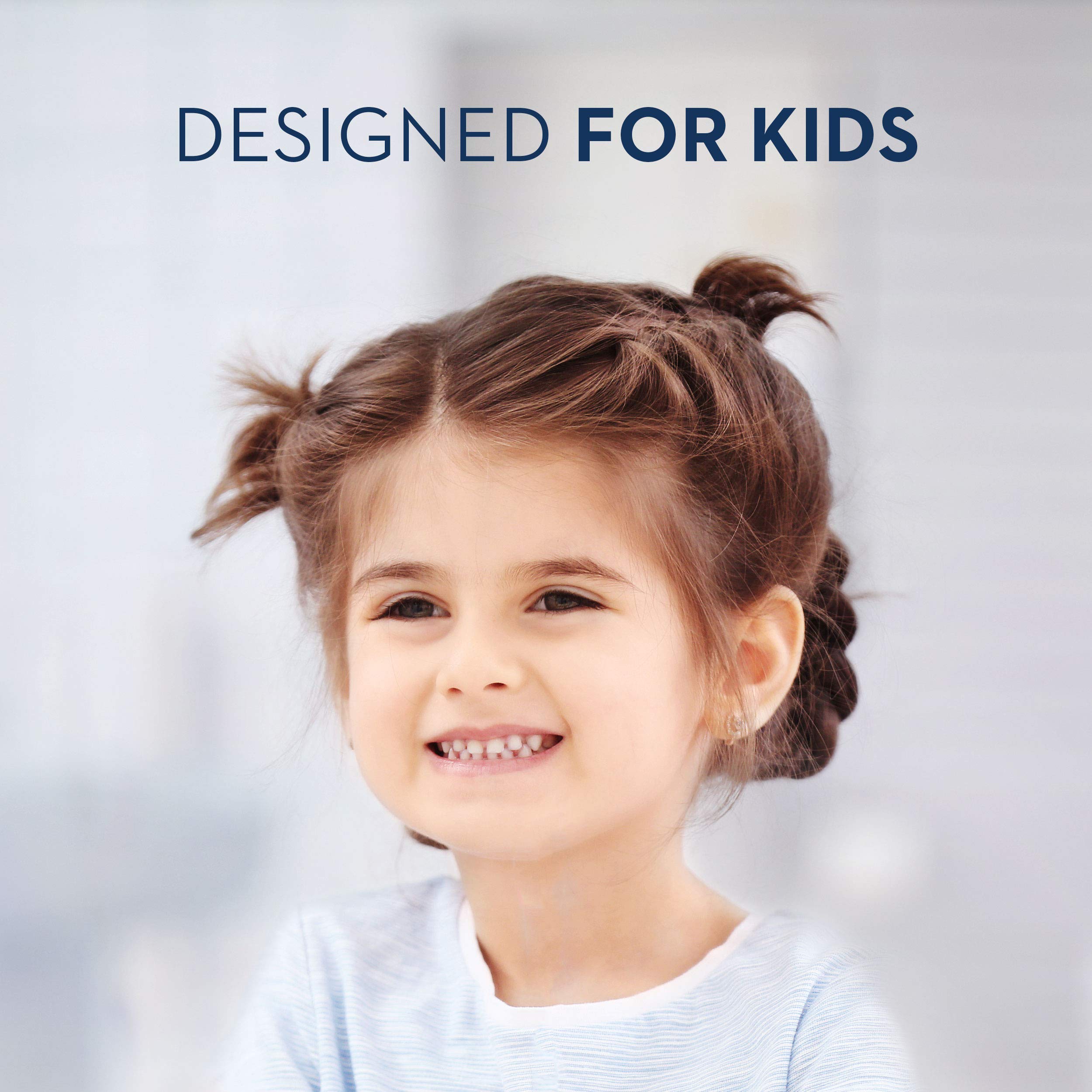 Child brushing teeth with Crest Kid's Strawberry Rush toothpaste