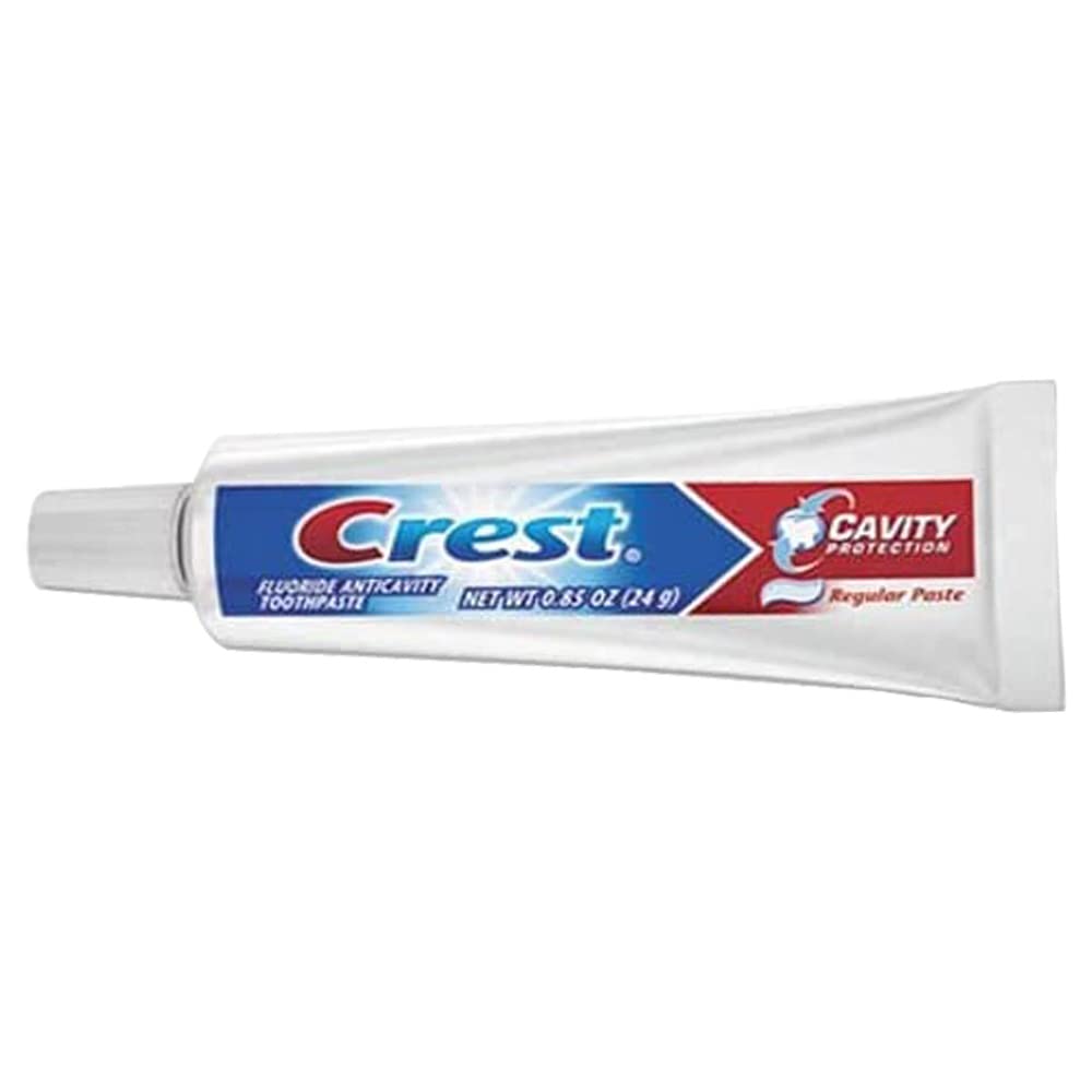 Close-up of Crest travel-size toothpaste tubes suitable for hospitality or dentist offices.