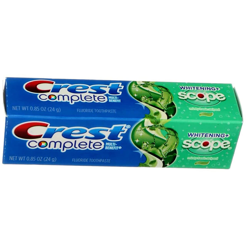 Side view of eight Crest toothpaste tubes
