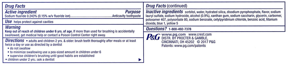 Close-up of Crest Complete toothpaste tube highlighting whitening formula.