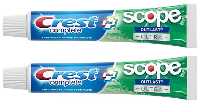 Two Crest Complete toothpaste tubes showing Active Fresh + Whitening formula