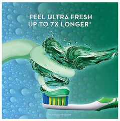 Close-up of Crest Complete toothpaste tube label highlighting whitening and fresh breath