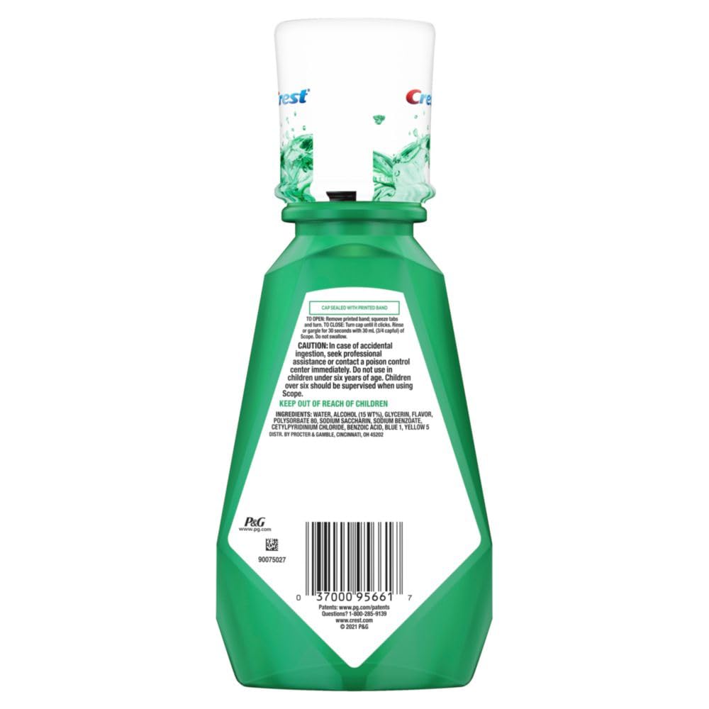 Person rinsing mouth with Crest Scope Classic Mouthwash