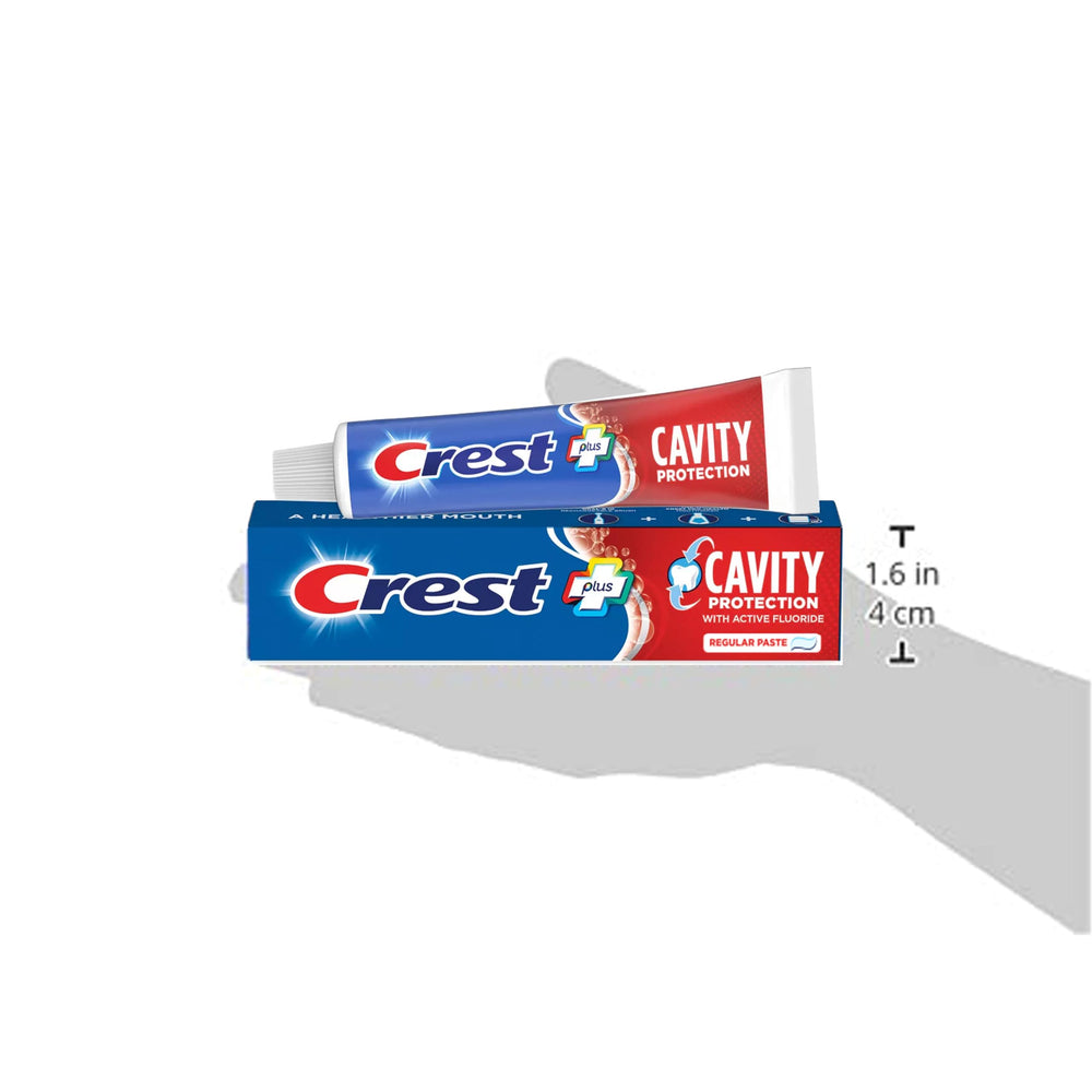 Tube and packaging of Crest toothpaste on white background
