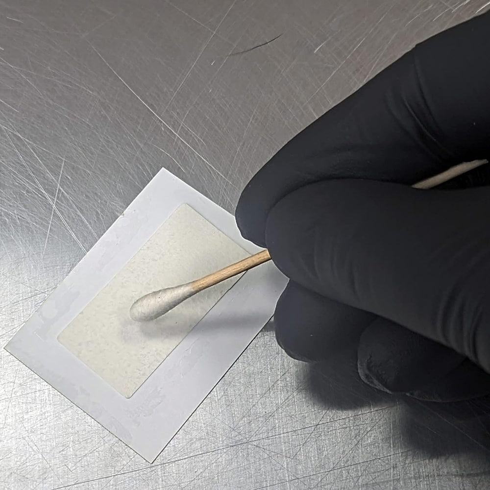 Purple color on test strip indicating semen presence