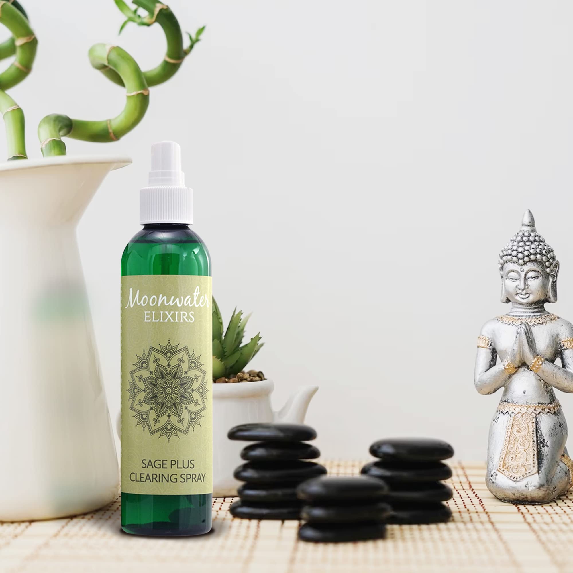 Crystal-infused sage spray with clear quartz crystals