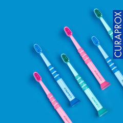 Random colour variants of Curaprox baby toothbrush
