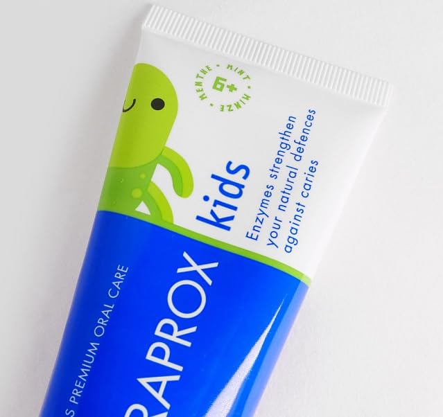 Child brushing teeth with Curaprox Kids toothpaste