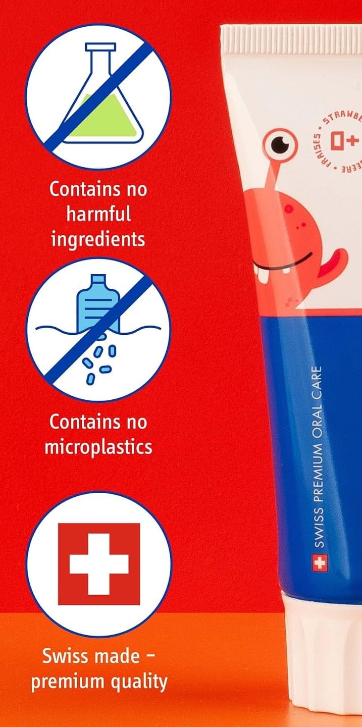 Happy child brushing with strawberry toothpaste