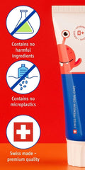 Happy child brushing with strawberry toothpaste