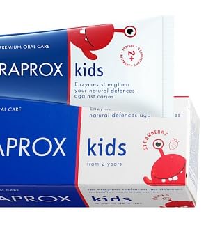 Non-mint strawberry toothpaste with sorbitol and xylitol