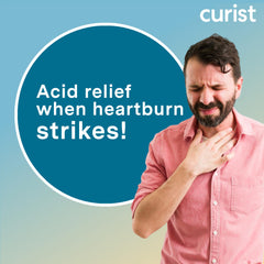 Curist Famotidine 20mg tablets in hand for easy on-the-go relief.