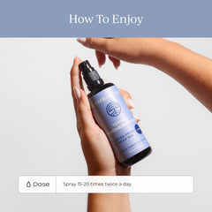 Applying magnesium oil spray to the leg