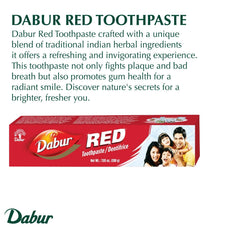 Tube of Dabur Red Toothpaste being held by hand