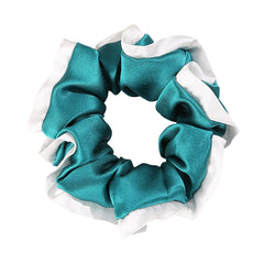 DAISYSILK pure mulberry silk scrunchie in Aqua Green worn for a gentle no-pull hold.