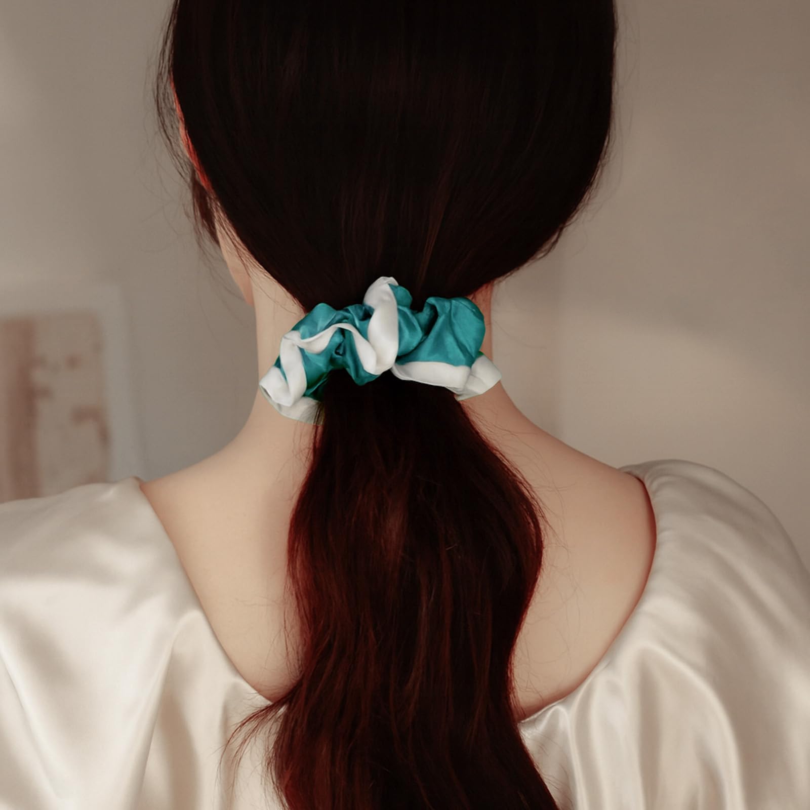 DAISYSILK silk bun holder in Aqua Green for neat updo.
