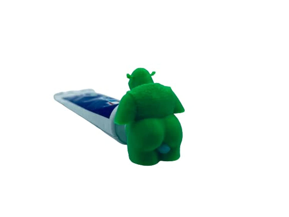 Front view of Daodan Shrek Pooping Toothpaste Cap in green