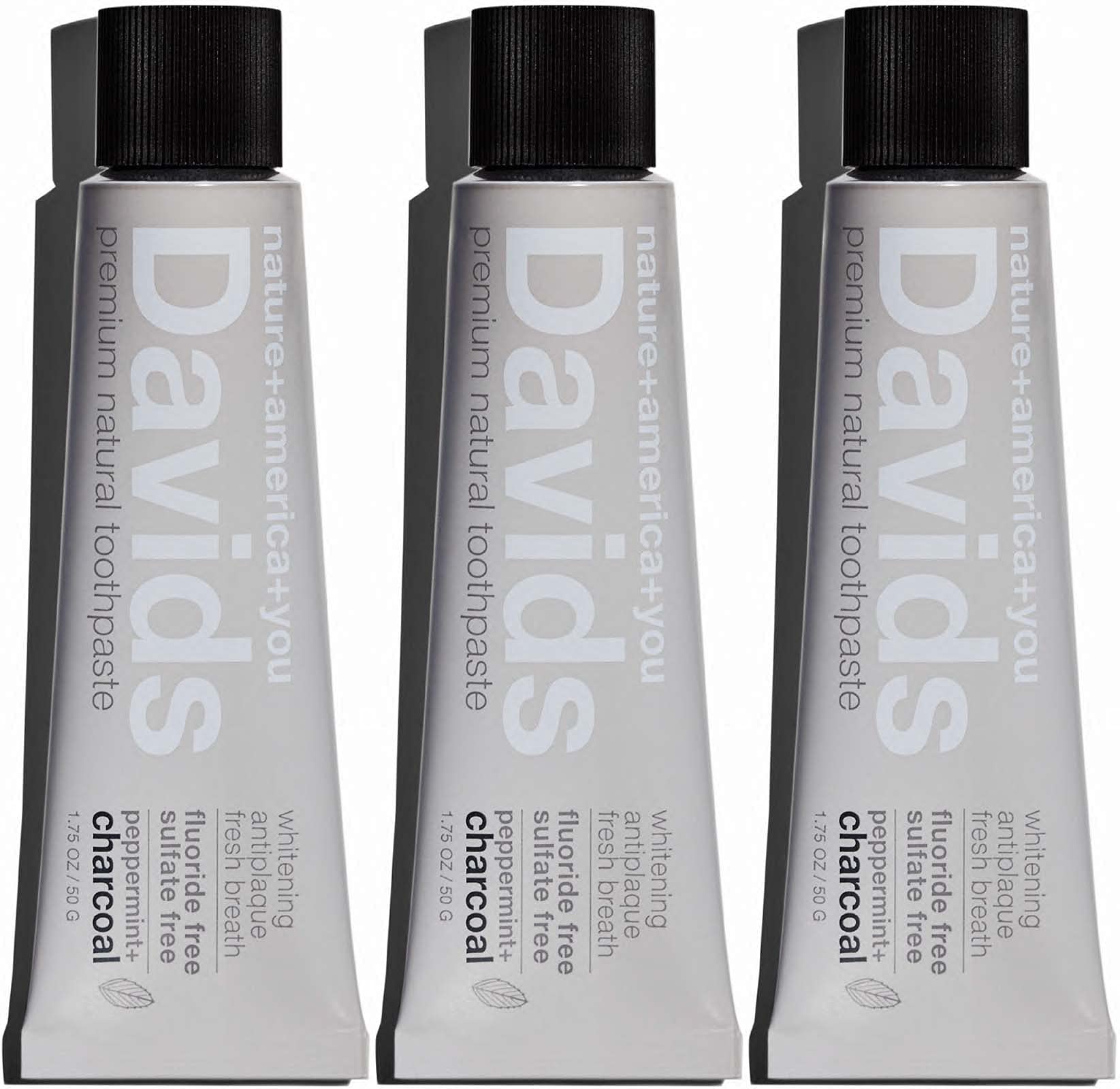 Person brushing teeth with Davids charcoal toothpaste