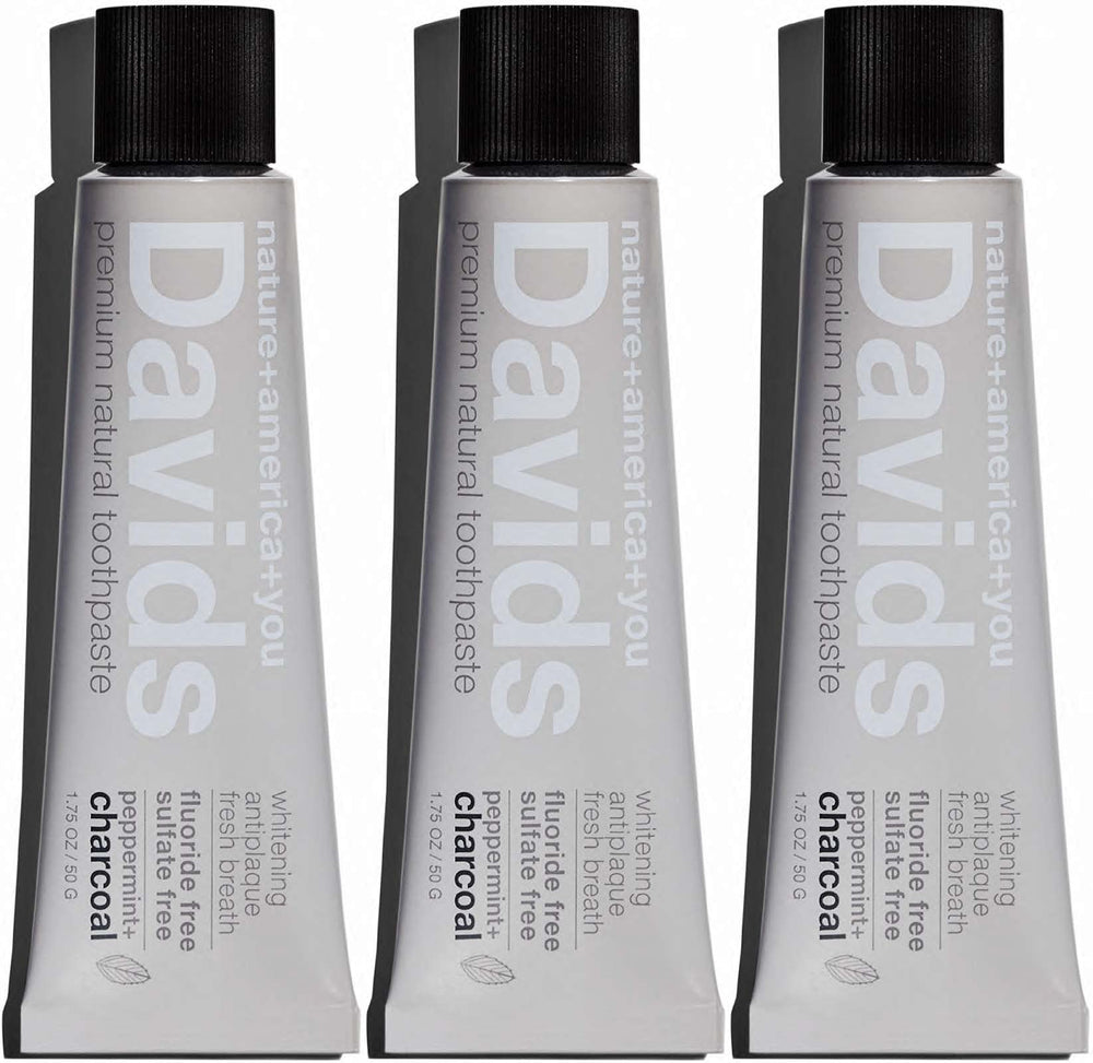 Person brushing teeth with Davids charcoal toothpaste