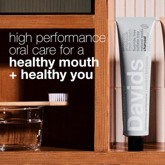 Squeezing Davids Charcoal Toothpaste from recyclable metal tube with squeezer