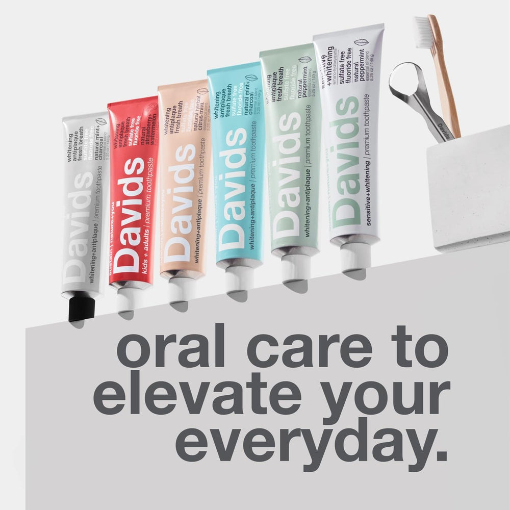 Person using Davids Fluoride Free Toothpaste tube