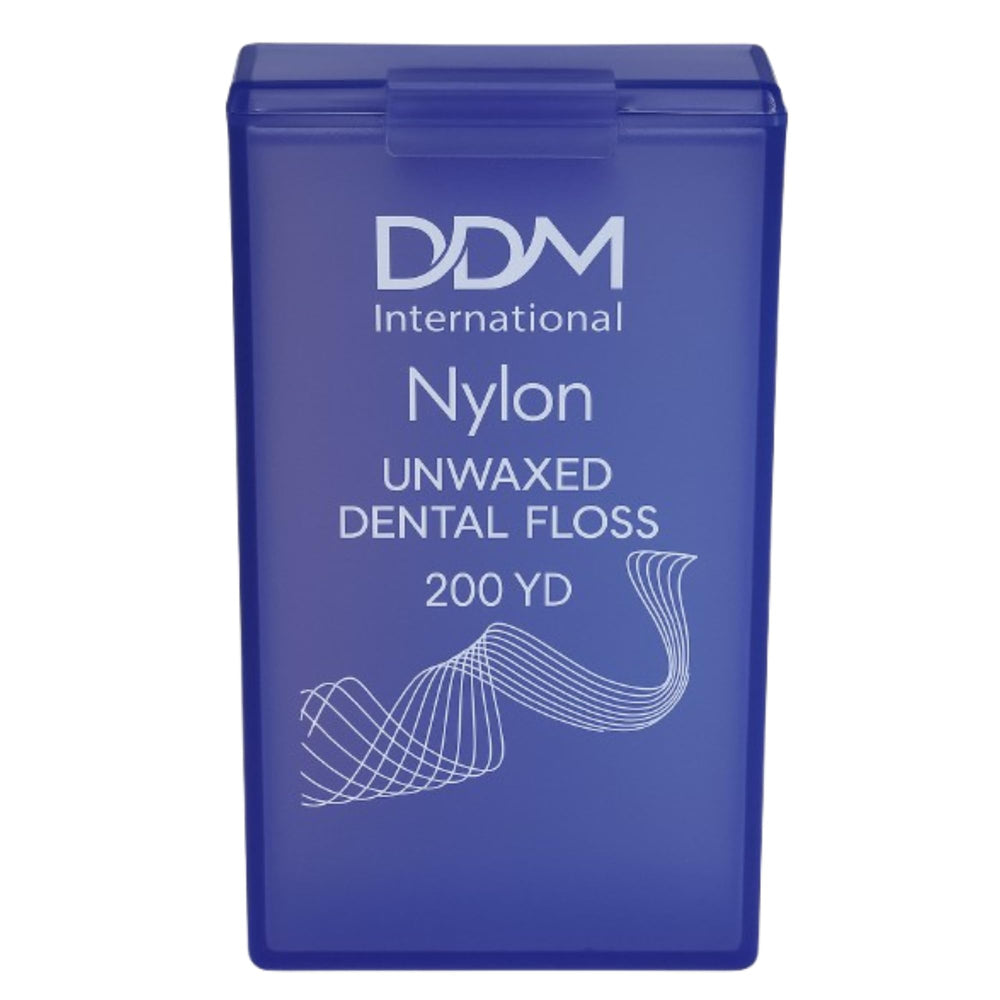 DDM International unwaxed nylon dental floss in translucent purple dispenser