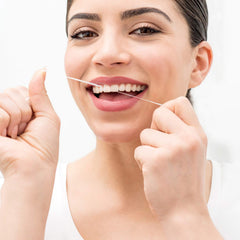 Beeswax-coated dental tape for smooth no-shred use
