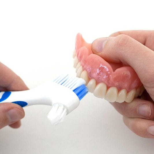 Close-up of multi-tiered bristles on the denture brush