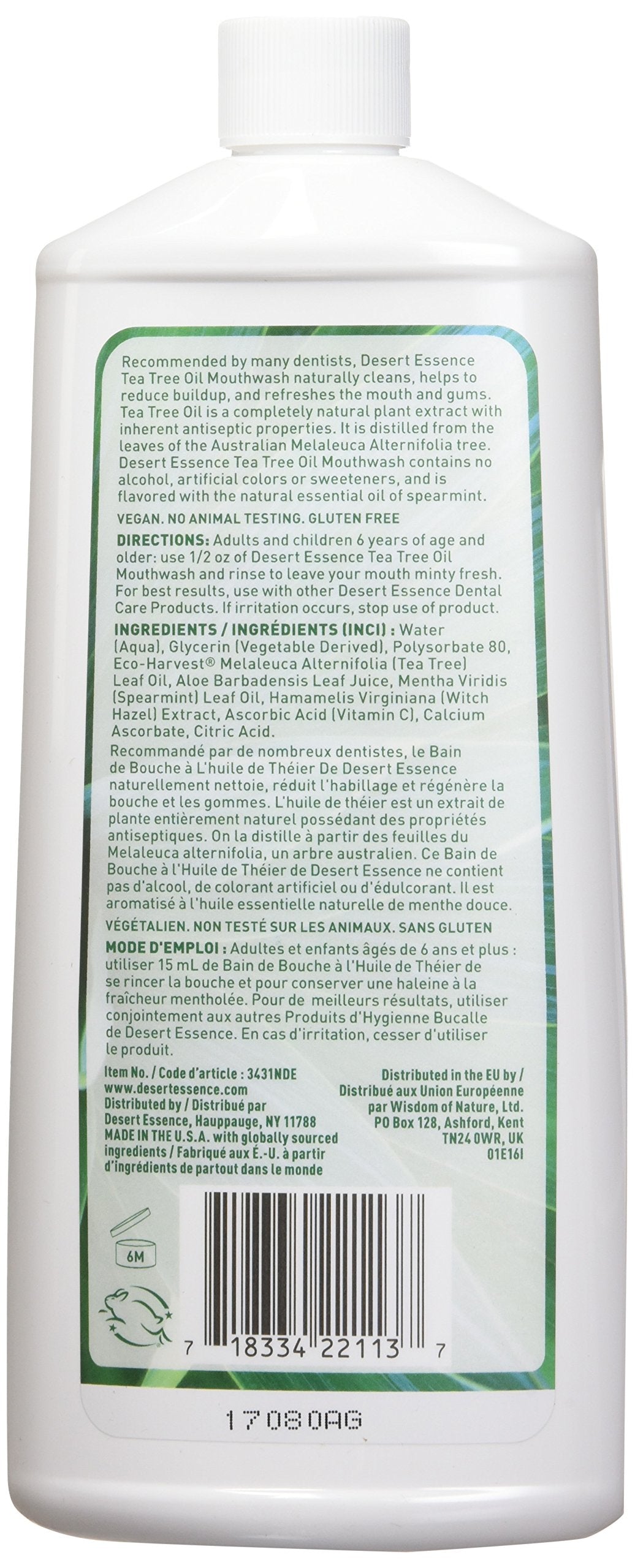 Close-up of Desert Essence mouthwash label featuring Tea Tree Oil and Spearmint