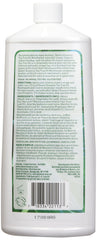 Close-up of Desert Essence mouthwash label featuring Tea Tree Oil and Spearmint