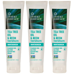 Desert Essence toothpaste 3-pack box and tubes on white background