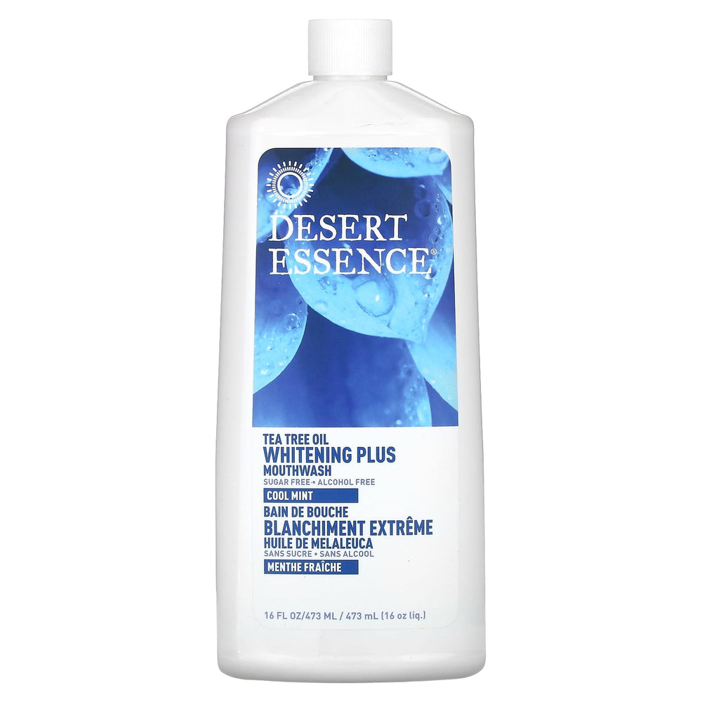Desert Essence Tea Tree Whitening Mint Mouthwash bottle 16 oz on a bathroom counter