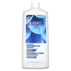 Desert Essence Tea Tree Whitening Mint Mouthwash bottle 16 oz on a bathroom counter