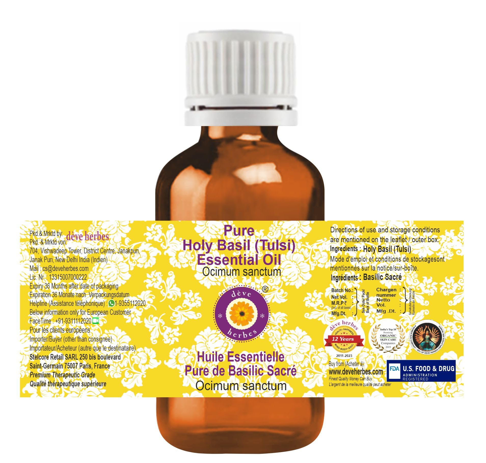 Close-up of Deve Herbes Holy Basil essential oil bottle with label