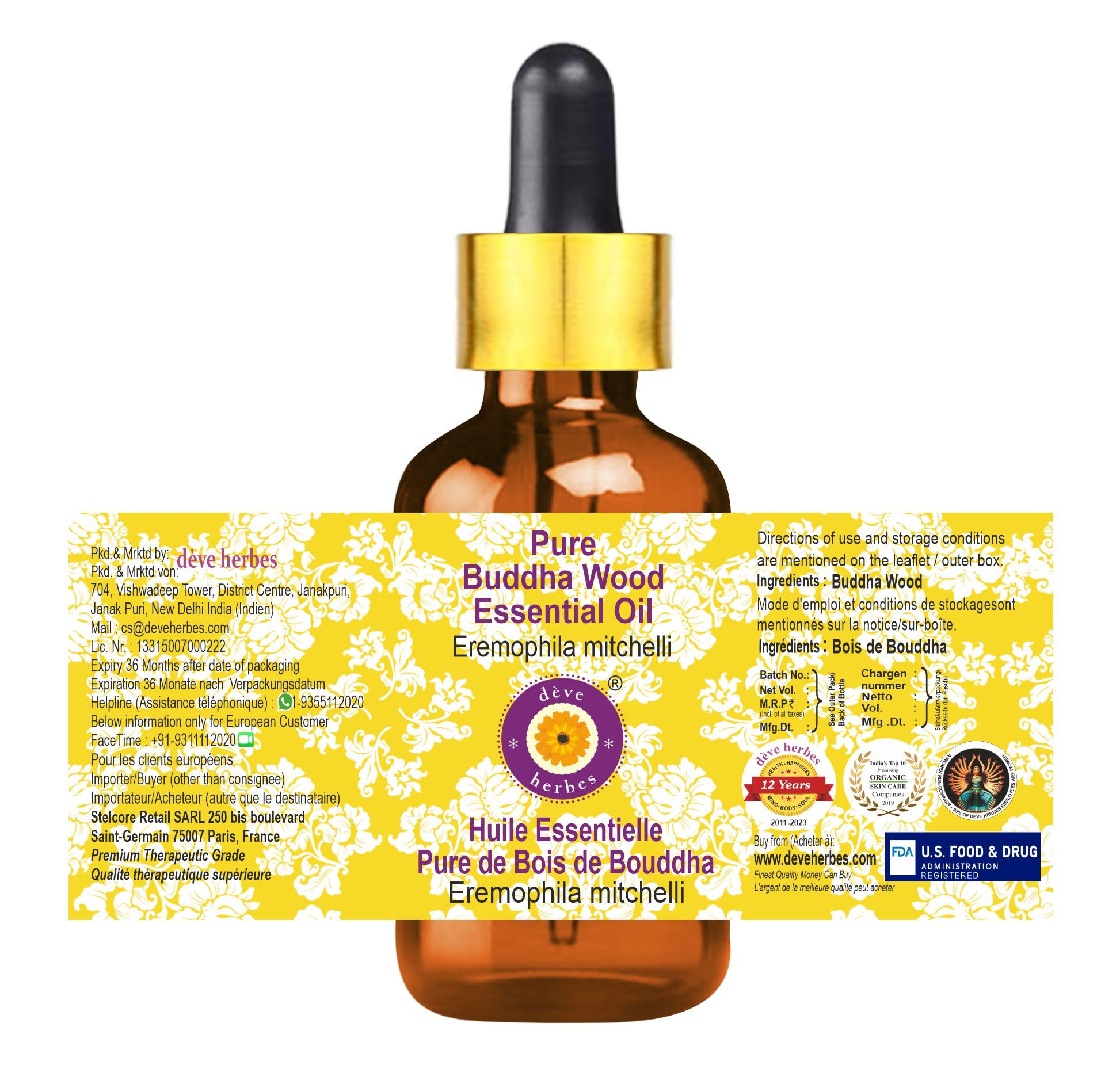 Amber glass bottle of Buddha Wood essential oil with dropper