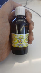 Amber glass bottle of Styrax essential oil on white background