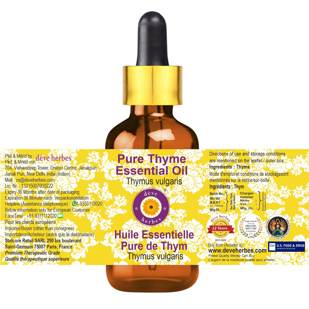Close-up of thyme essential oil bottle (Thymus vulgaris) in amber glass